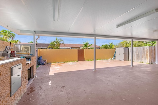 14712 SW 84th Ter, Miami, FL 33193 - fenced backyard with a patio and a storage unit