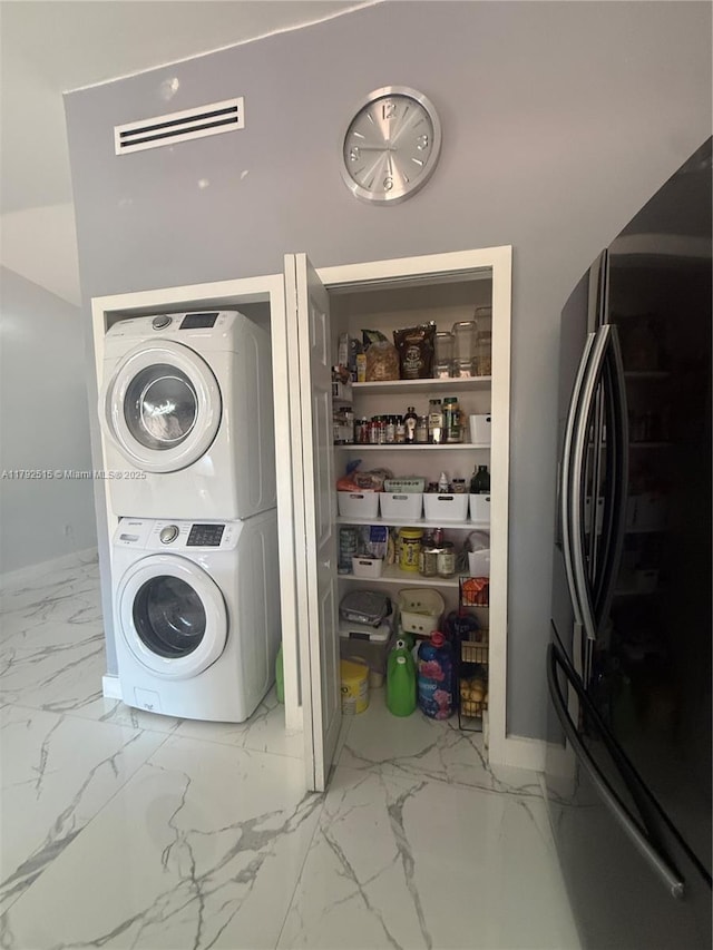 14712 SW 84th Ter, Miami, FL 33193 - washroom with stacked washing maching and dryer, laundry area, marble finish floor, and visible vents