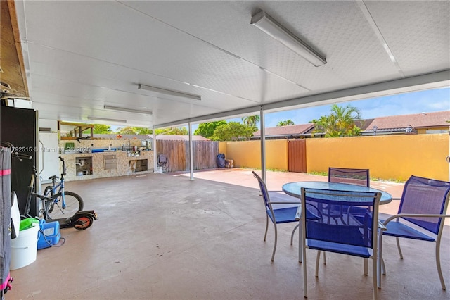 14712 SW 84th Ter, Miami, FL 33193 - fenced backyard featuring a patio area, outdoor dining space, and exterior kitchen
