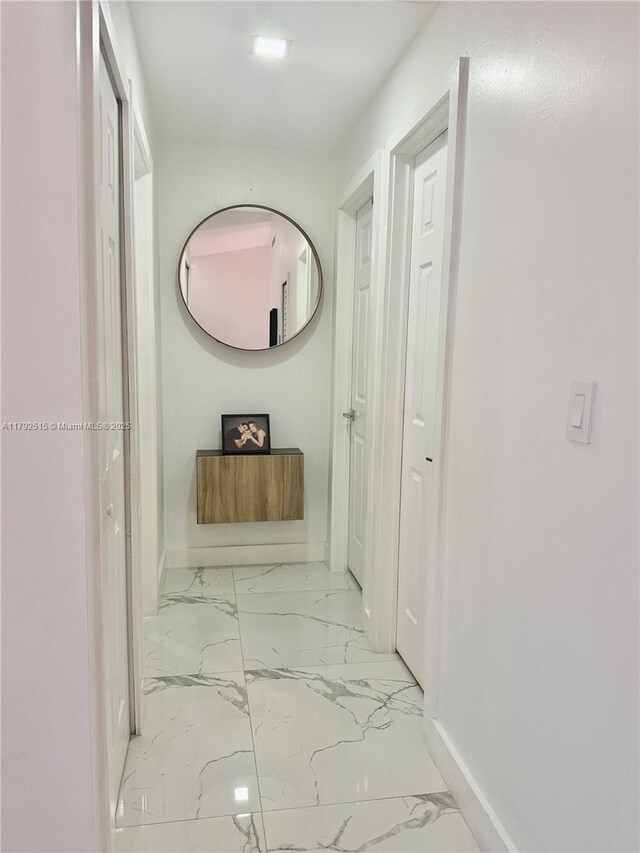 14712 SW 84th Ter, Miami, FL 33193 - corridor with baseboards and marble finish floor
