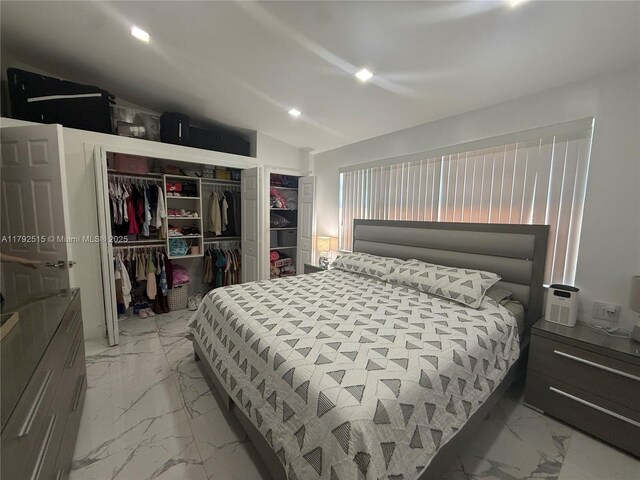 14712 SW 84th Ter, Miami, FL 33193 - bedroom with a closet, recessed lighting, marble finish floor, and vaulted ceiling