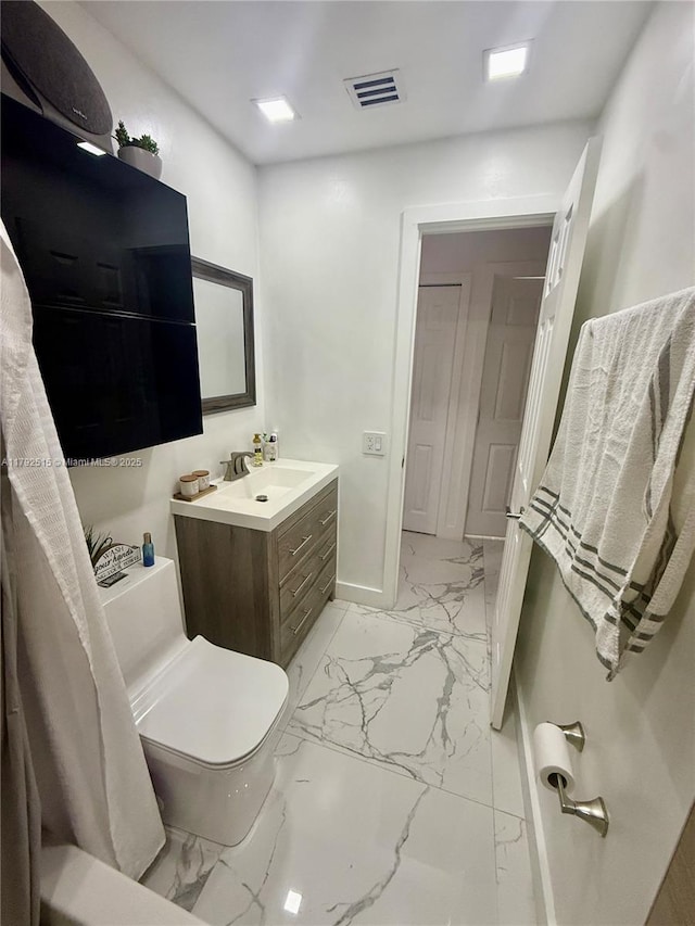 14712 SW 84th Ter, Miami, FL 33193 - bathroom featuring visible vents, vanity, marble finish floor, toilet, and baseboards