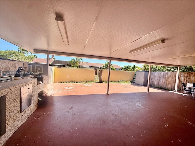 14712 SW 84th Ter, Miami, FL 33193 - view of patio with fence and an outdoor kitchen