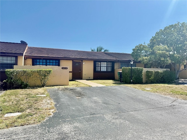 14712 SW 84th Ter, Miami, FL 33193 - single story home with stucco siding, a tiled roof, and fence