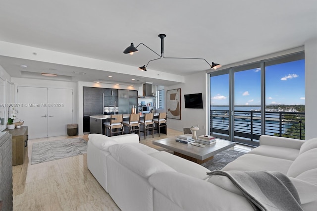 living area featuring a wall of windows