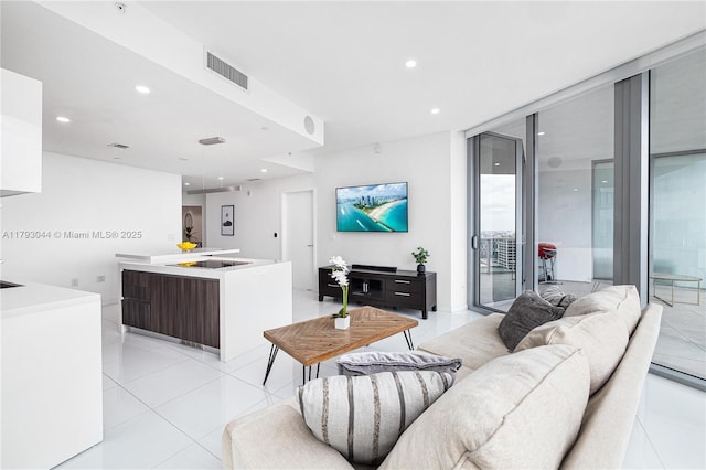 851 NE 1st Ave Unit 2604, Miami, FL 33132 - living room with light tile patterned floors, recessed lighting, and expansive windows