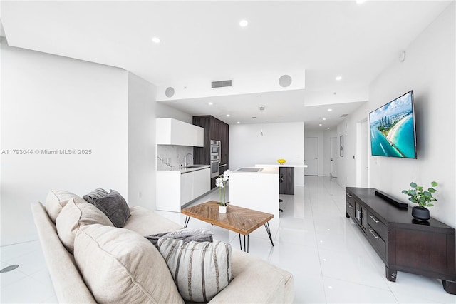 851 NE 1st Ave Unit 2604, Miami, FL 33132 - living room featuring light tile patterned floors and recessed lighting