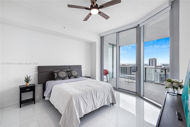 851 NE 1st Ave Unit 2604, Miami, FL 33132 - bedroom with floor to ceiling windows, access to outside, light tile patterned flooring, a view of city, and a ceiling fan