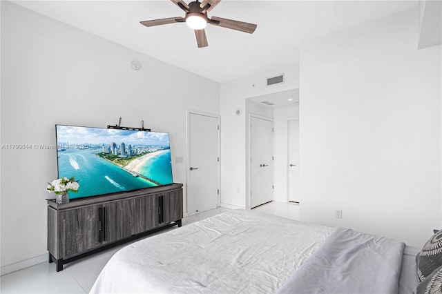 851 NE 1st Ave Unit 2604, Miami, FL 33132 - tiled bedroom with ceiling fan and baseboards