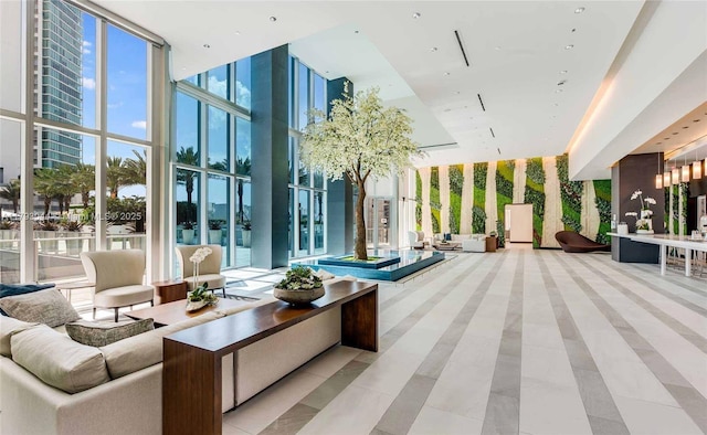 851 NE 1st Ave Unit 2604, Miami, FL 33132 - building lobby featuring floor to ceiling windows and a towering ceiling