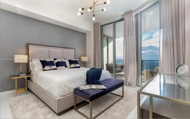 851 NE 1st Ave Unit 2604, Miami, FL 33132 - bedroom with access to exterior and a chandelier