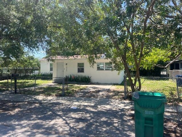 1864 NW 88th Ter, Miami, FL 33147 - view of front of house featuring fence private yard and stucco siding