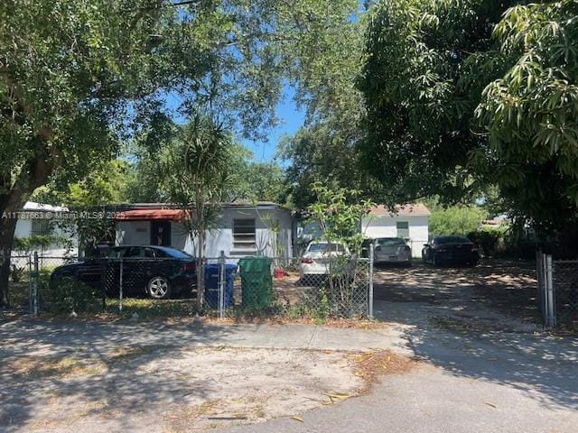 1864 NW 88th Ter, Miami, FL 33147 - view of front of property featuring fence and aphalt driveway