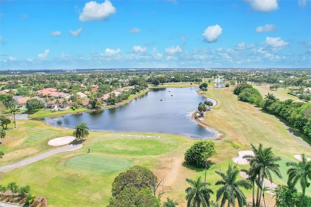 aerial view with a residential view, a water view, and golf course view