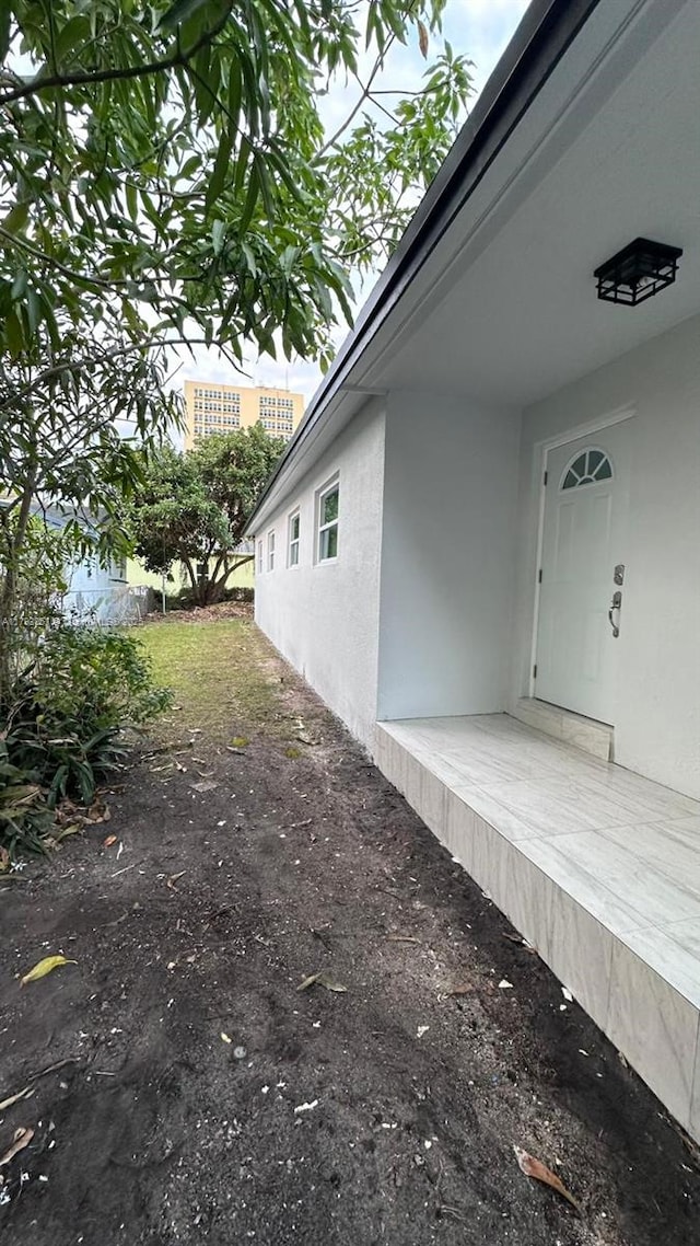 exterior space featuring stucco siding