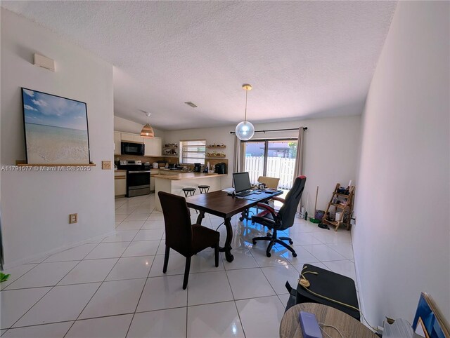 11212 SW 58th Cir, Cooper City, FL 33330 - dining space featuring light tile patterned flooring, a textured ceiling, and visible vents