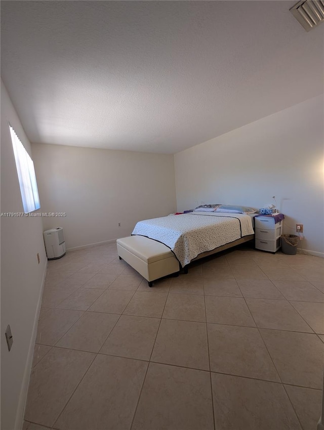 11212 SW 58th Cir, Cooper City, FL 33330 - bedroom featuring visible vents, baseboards, and light tile patterned flooring