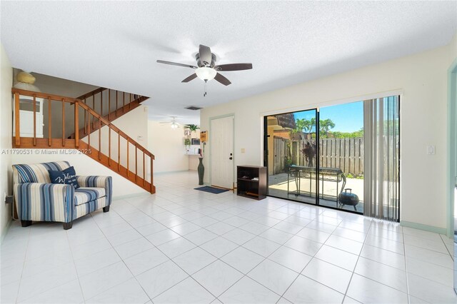 720 7th Ln, Green Acres, FL 33463 - tiled living area featuring stairs, a ceiling fan, baseboards, and visible vents
