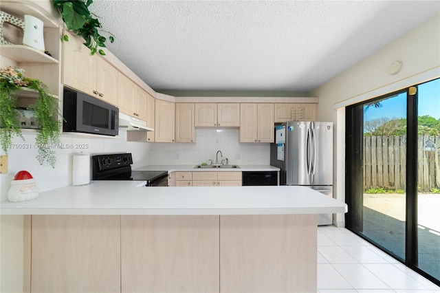 720 7th Ln, Green Acres, FL 33463 - kitchen featuring under cabinet range hood, a sink, black appliances, and light countertops