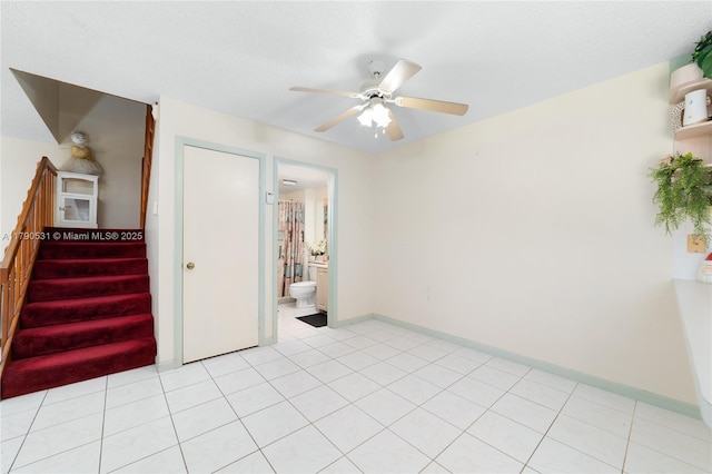 720 7th Ln, Green Acres, FL 33463 - empty room featuring baseboards, ceiling fan, and stairway