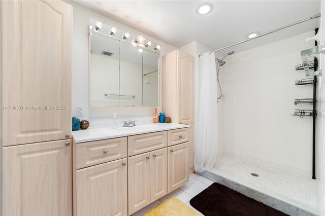 720 7th Ln, Green Acres, FL 33463 - full bath with vanity, tile patterned floors, tiled shower, and visible vents