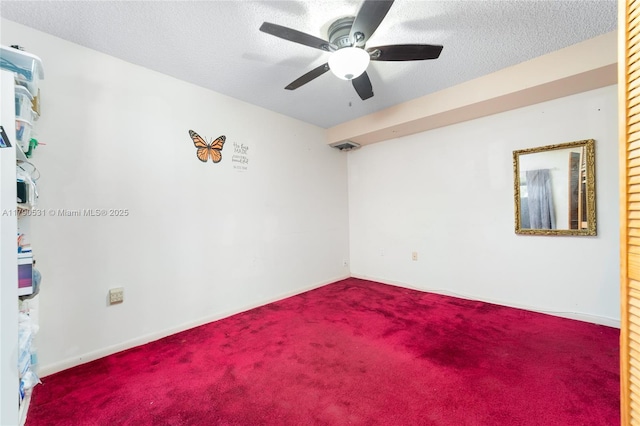720 7th Ln, Green Acres, FL 33463 - carpeted spare room with baseboards, ceiling fan, and a textured ceiling