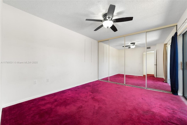 720 7th Ln, Green Acres, FL 33463 - unfurnished bedroom featuring carpet flooring, a textured ceiling, baseboards, visible vents, and a closet