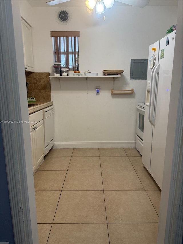 kitchen with white appliances, baseboards, ceiling fan, white cabinetry, and light tile patterned floors