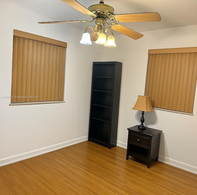 40 NE 49th St, Miami, FL 33137 - empty room with a ceiling fan, wood finished floors, and baseboards