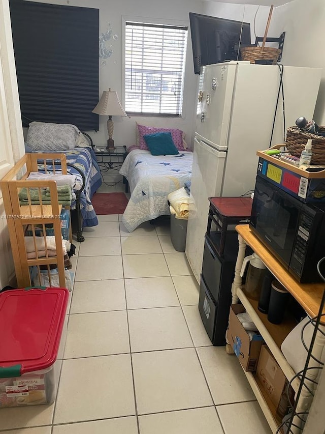 bedroom with light tile patterned floors