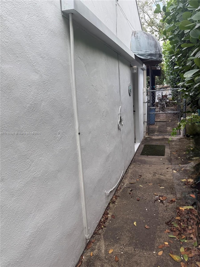 view of side of home with stucco siding