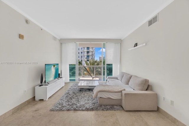 living area featuring baseboards, ornamental molding, and visible vents