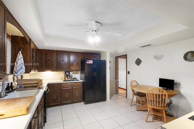 8261 SW 186th St, Cutler Bay, FL 33157 - living room featuring wooden walls, a textured ceiling, a raised ceiling, and brick wall