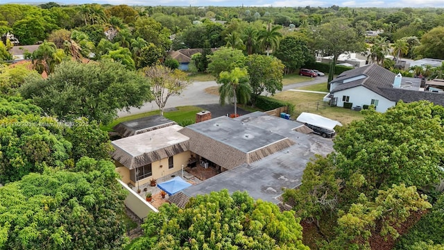 birds eye view of property with a forest view