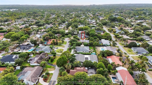 birds eye view of property with a residential view