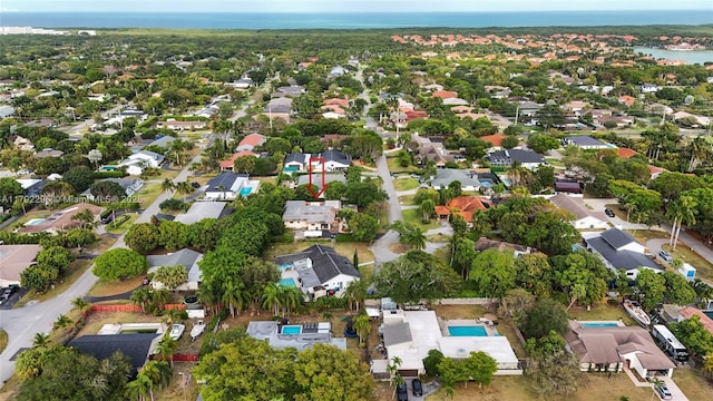 bird's eye view with a water view and a residential view