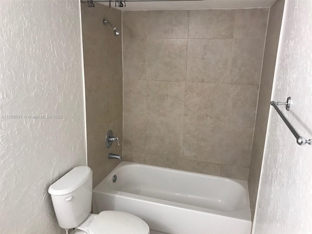 13120 SW 92nd Ave Unit B-222, Miami, FL 33176 - full bath with a textured wall, shower / bathtub combination, and toilet