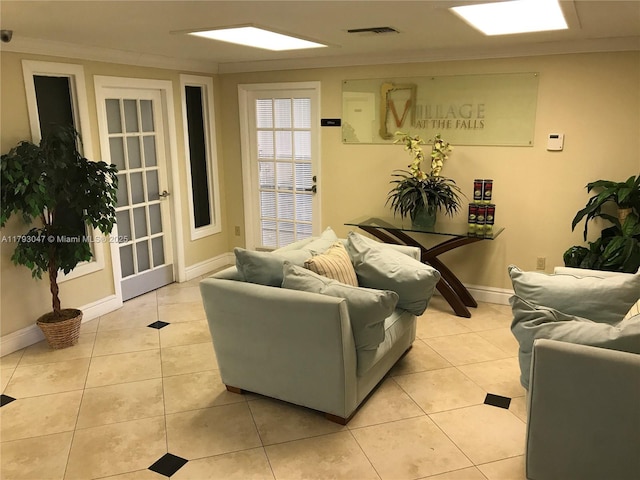 13120 SW 92nd Ave Unit B-222, Miami, FL 33176 - living area featuring visible vents, ornamental molding, baseboards, and light tile patterned flooring