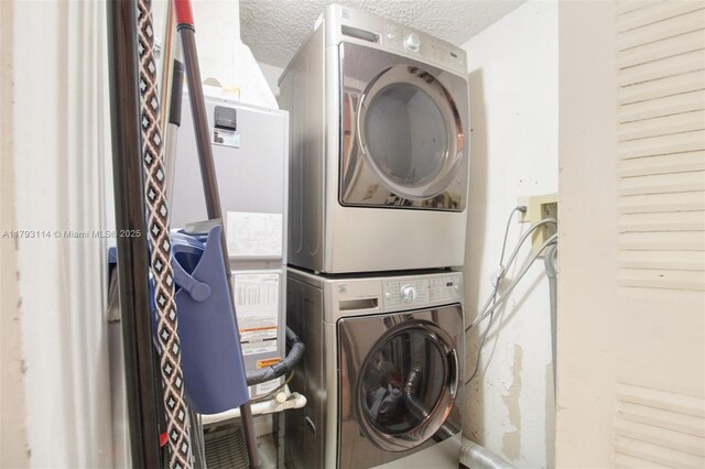 8023 Lake Dr Unit 201, Doral, FL 33166 - laundry area featuring a textured ceiling, stacked washer / dryer, and laundry area