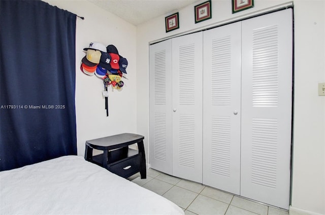 8023 Lake Dr Unit 201, Doral, FL 33166 - bedroom featuring light tile patterned floors and a closet