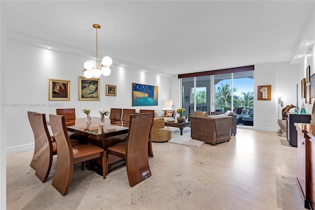 727 Crandon Blvd Unit 401, Key Biscayne, FL 33149 - dining space featuring an inviting chandelier, baseboards, and a wall of windows