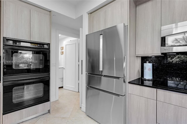 727 Crandon Blvd Unit 401, Key Biscayne, FL 33149 - kitchen with stainless steel appliances, modern cabinets, light tile patterned floors, and tasteful backsplash