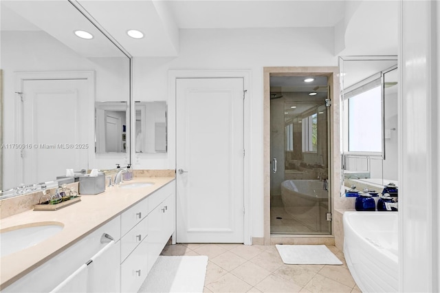 727 Crandon Blvd Unit 401, Key Biscayne, FL 33149 - bathroom with double vanity, a sink, a bath, and a shower stall