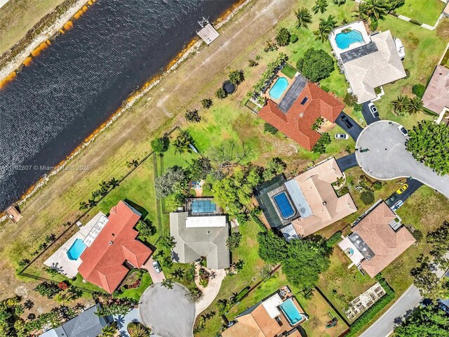 bird's eye view of a pool and a large body of water