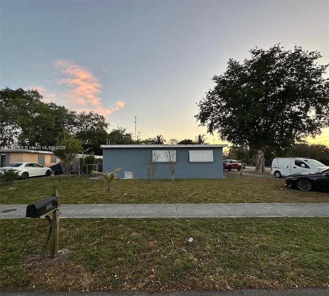 view of front of home with a lawn