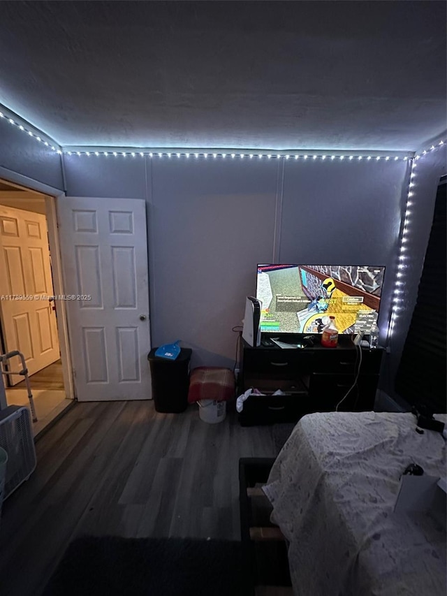 bedroom with wood finished floors