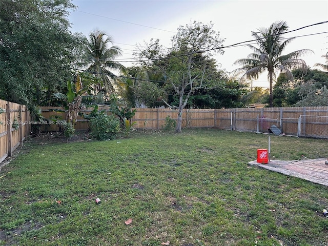 view of yard with a fenced backyard