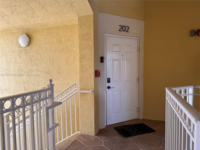 8838 W Flagler St Unit 202, Miami, FL 33174 - entrance to property with stucco siding and a balcony
