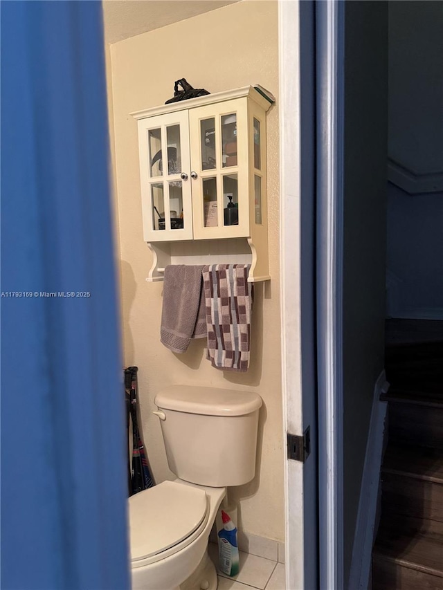 8838 W Flagler St Unit 202, Miami, FL 33174 - bathroom featuring tile patterned floors, toilet, and baseboards