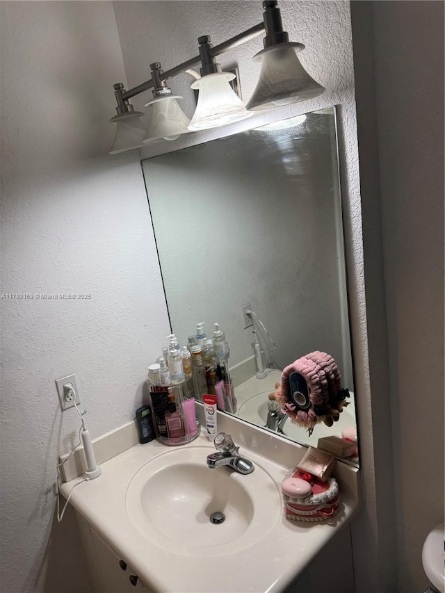 8838 W Flagler St Unit 202, Miami, FL 33174 - bathroom featuring vanity and a textured wall